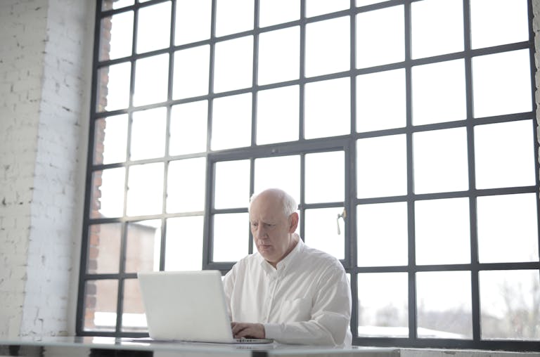 A Specialist Smoke Ventilation and Window Control engineer working on a project in a modern office setting.