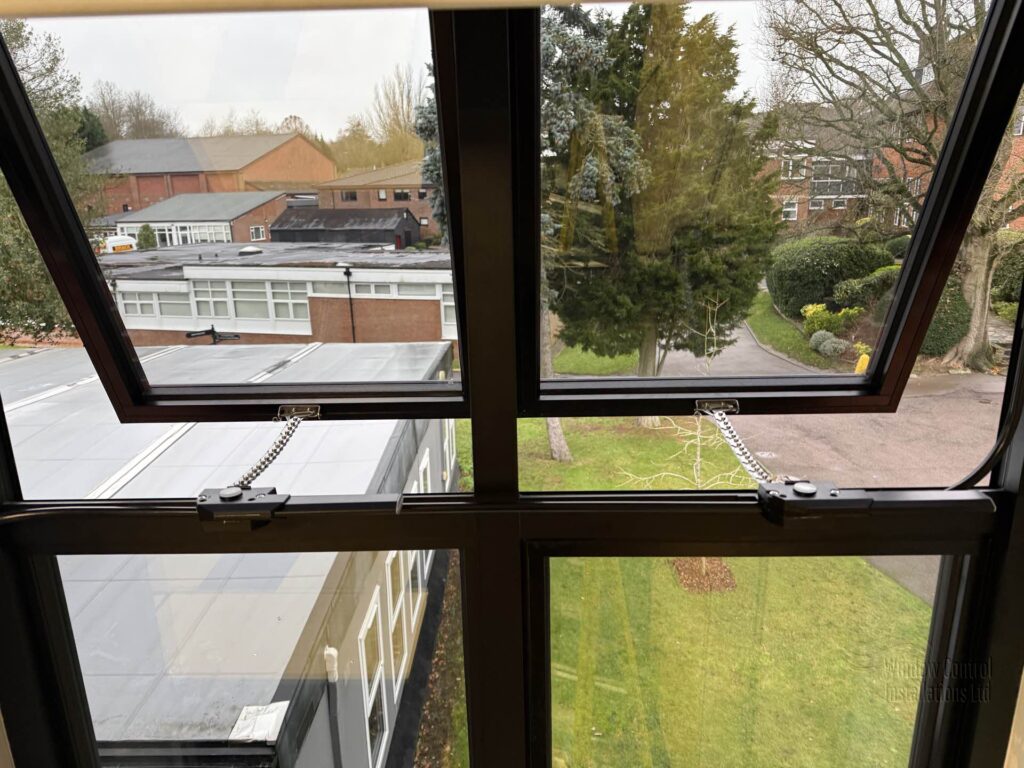 Macro detail shot of the Clearline 250 chain actuator mechanism showing the stainless steel chain.