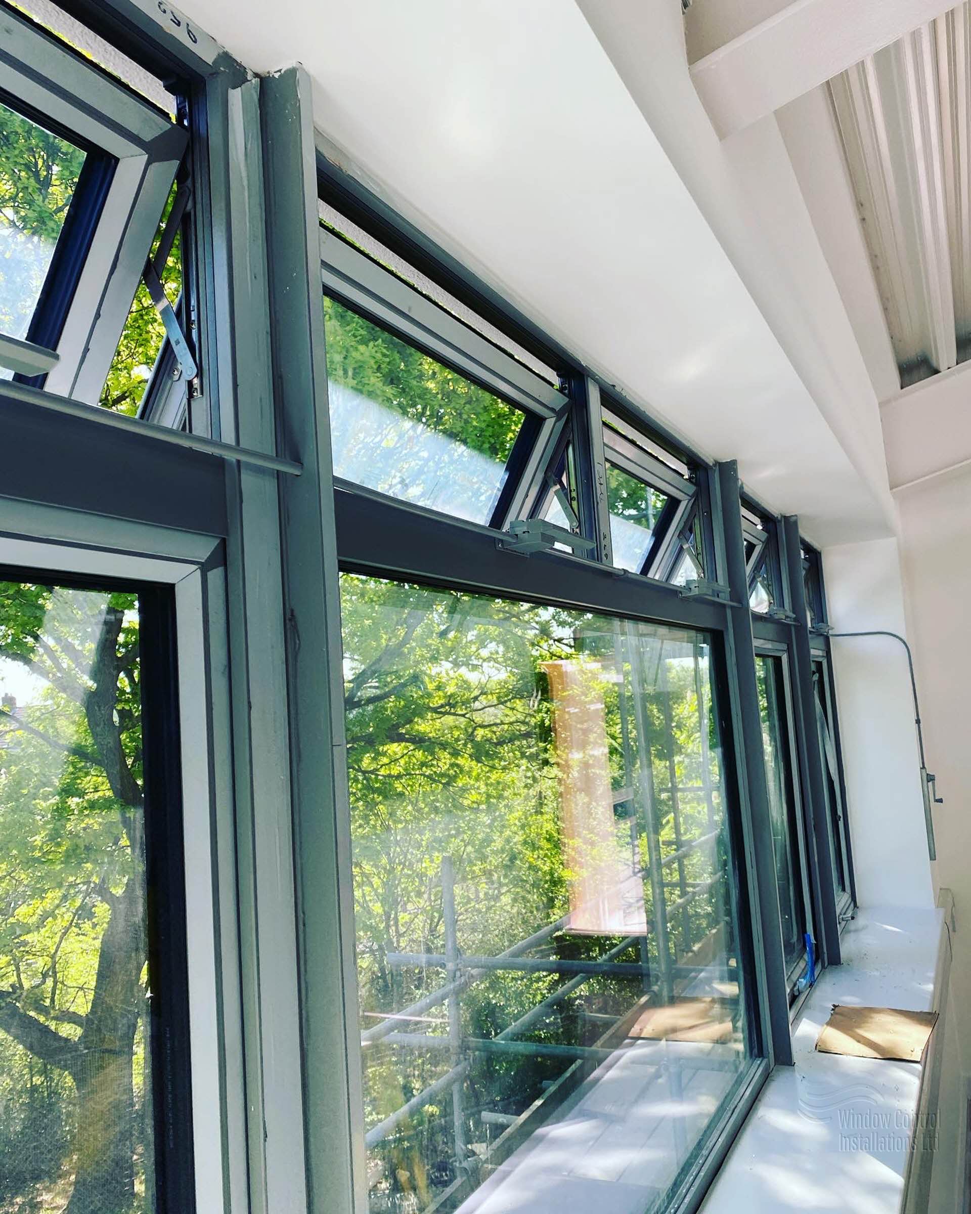 Hindle Morse Teleflex manual window opener installation showing mechanical chain system for high-level windows