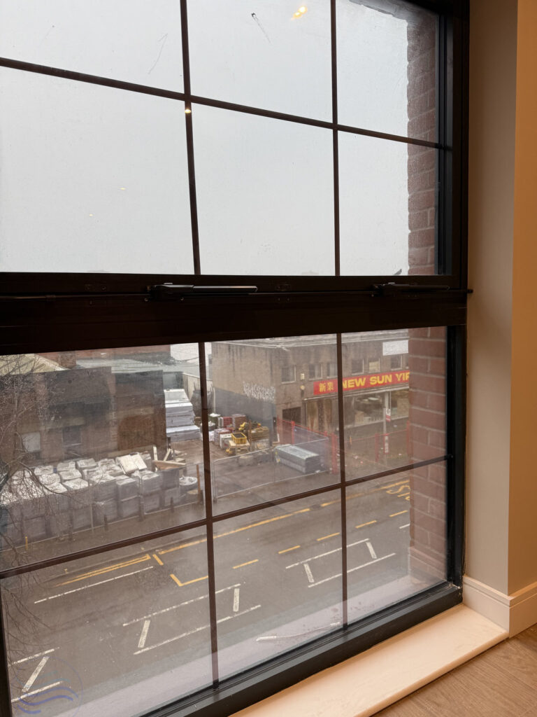 Integrated Teleflex manual window system on large, black-framed windows for a Galliard Homes project in Birmingham.