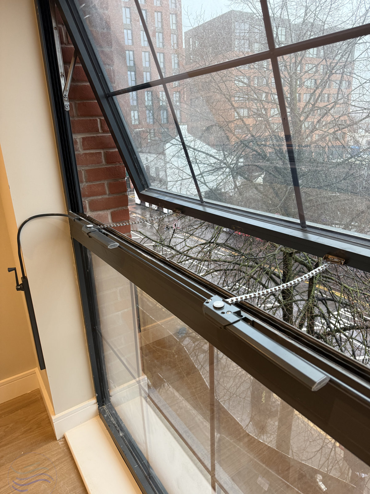 Close up of a manual window control system fully installed, using the Teleflex Clearline Midi XL control and Dual Teleflex 380 Chain Operators, providing maximum natural ventilation