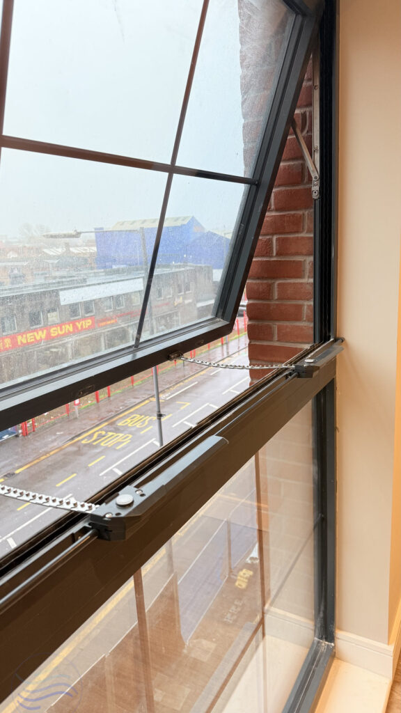Side profile of the Teleflex 380 Chain Opener in action on a high-performance window for Galliard Homes.